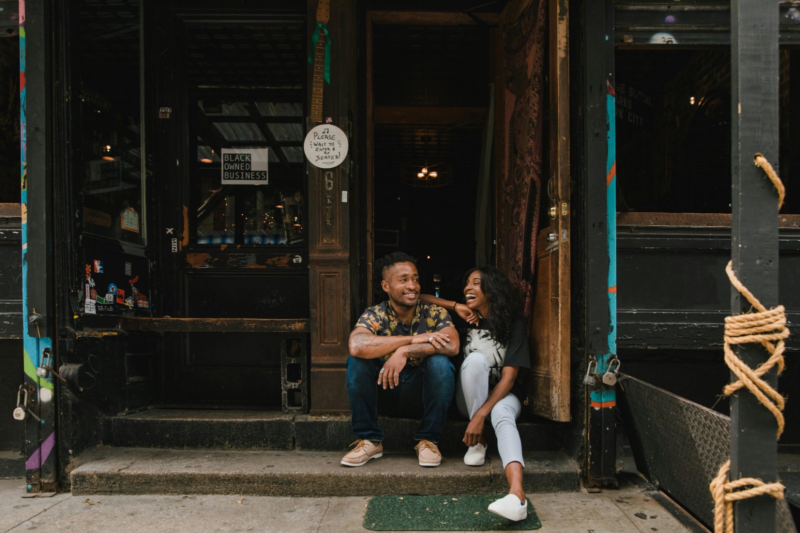 Australian small-business owners outside their shopfront